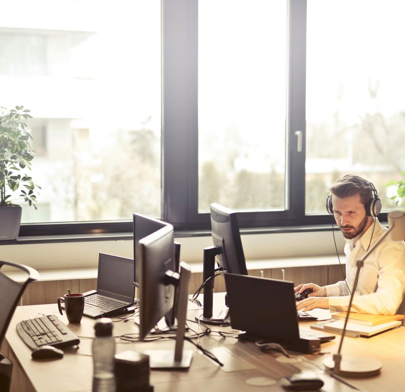 image of a man sitting at a desk working.