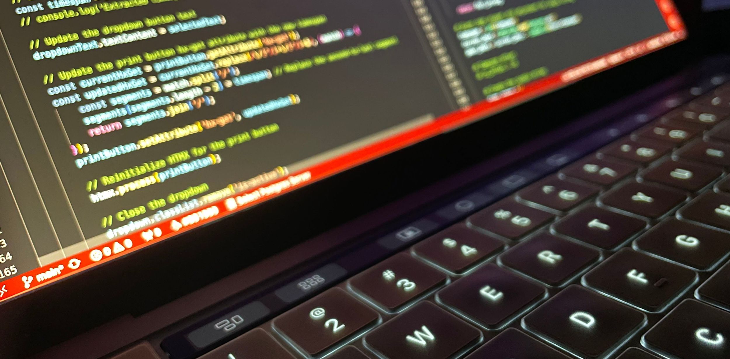 background image of a laptop with code on the screen.