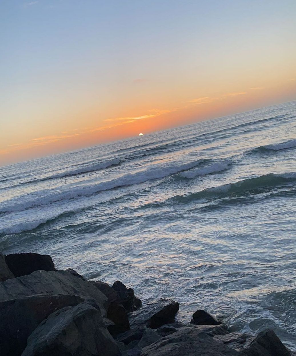 image of the sunset from the end of a jetty